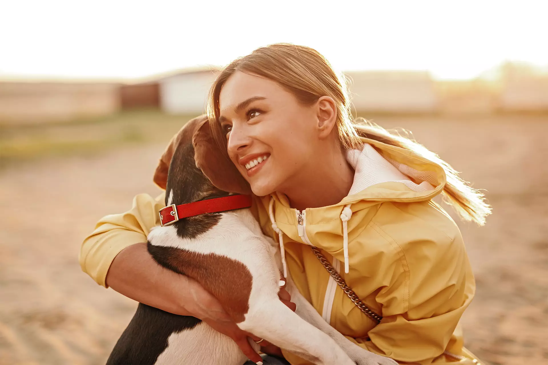 cheerful-lady-hugging-dog-and-smiling-2022-11-12-03-01-50-utc.jpg