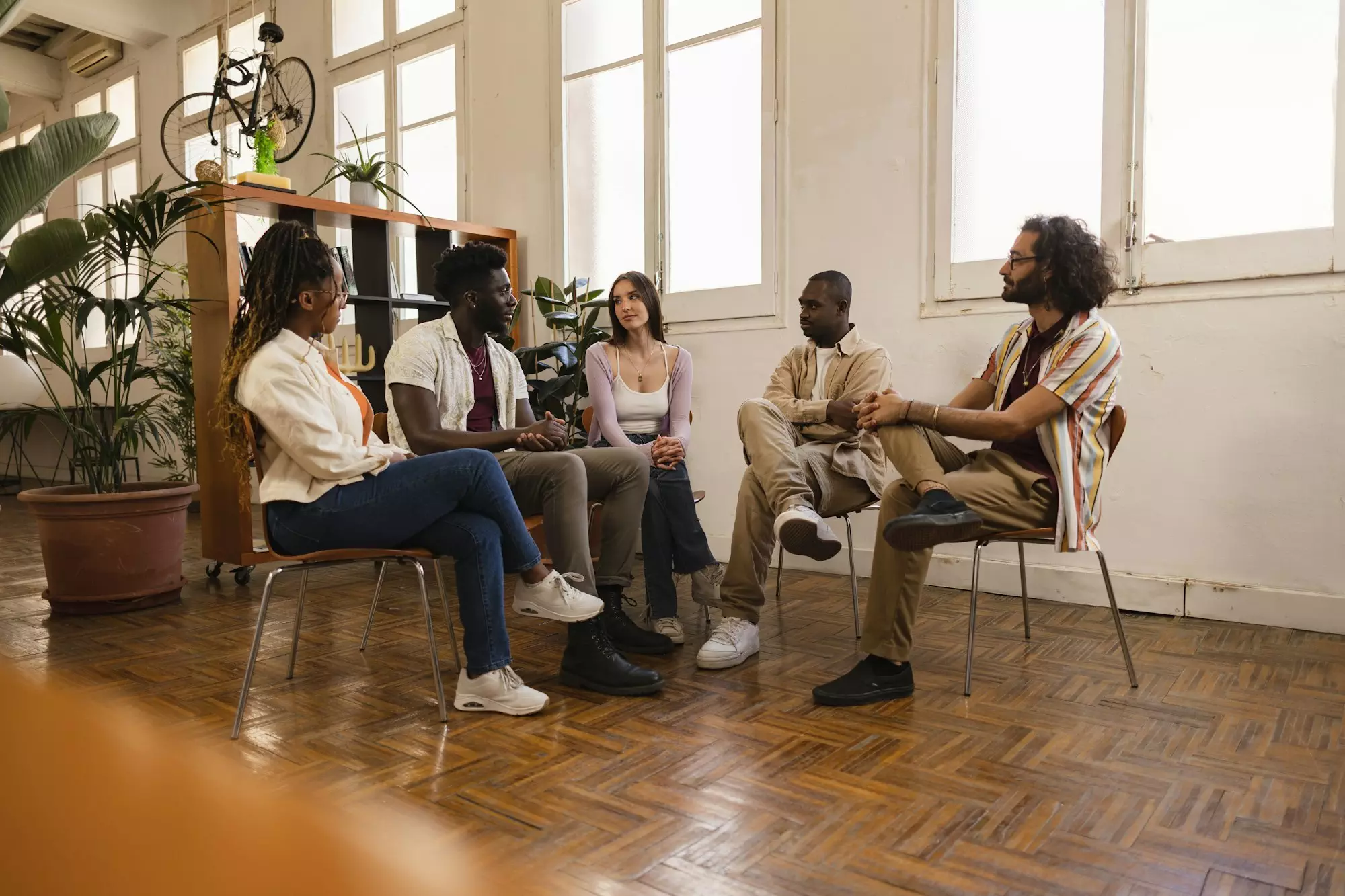 people with addiction sharing mental health problems with a group in a meeting,talking